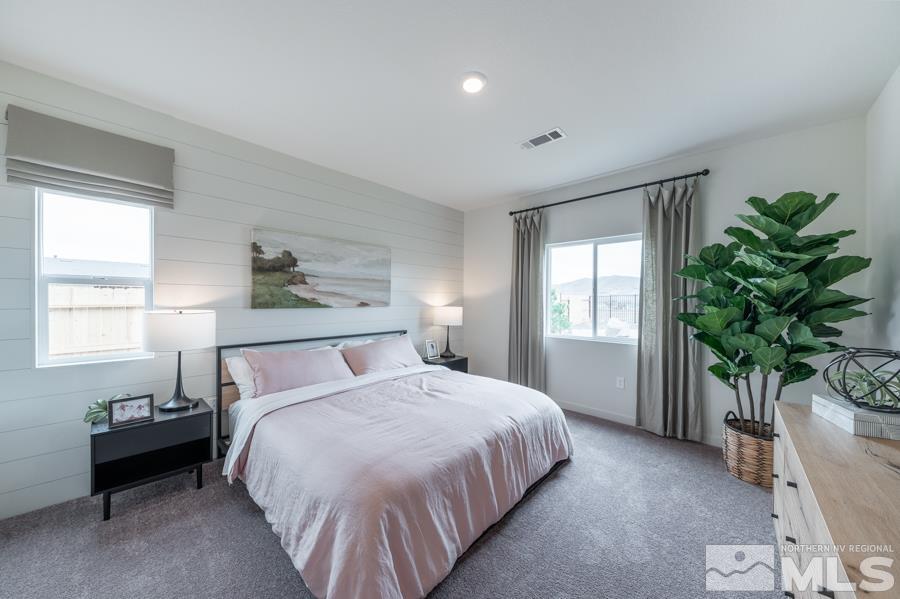 508 Russell Road, Unit LOT #96 Dayton, NV 89403 - Photo 11 of 17 a bedroom with a bed and a potted plant