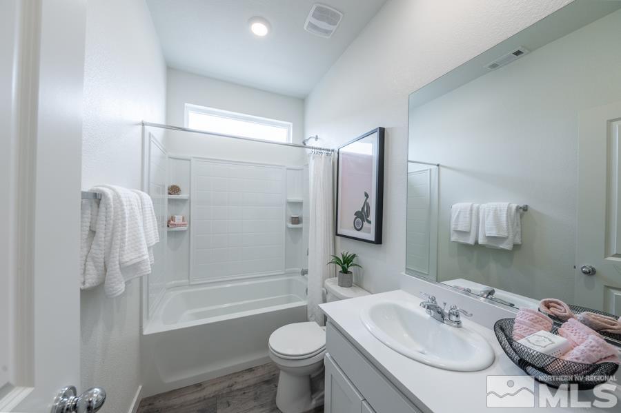 508 Russell Road, Unit LOT #96 Dayton, NV 89403 - Photo 16 of 17 a bathroom with a sink toilet and shower