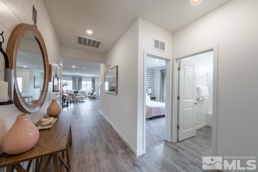 508 Russell Road, Unit LOT #96 Dayton, NV 89403 - Photo 2 of 17 a very nice looking room with wooden floor and a bathroom