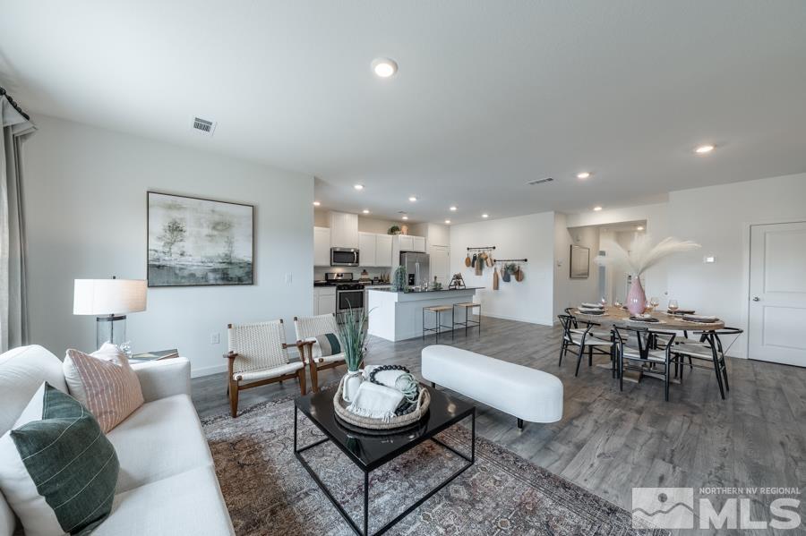508 Russell Road, Unit LOT #96 Dayton, NV 89403 - Photo 3 of 17 a living room with furniture a rug and kitchen view