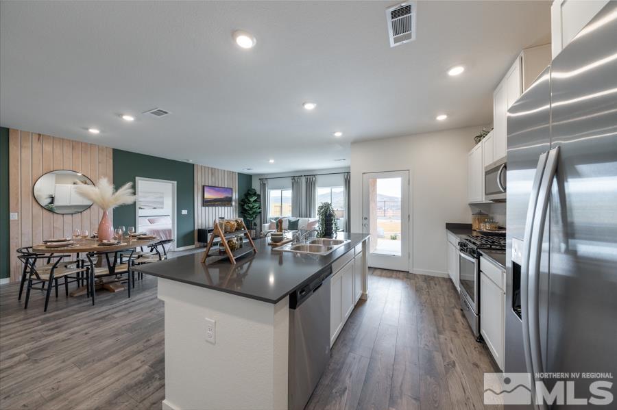 508 Russell Road, Unit LOT #96 Dayton, NV 89403 - Photo 7 of 17 a kitchen with lots of counter space and stainless steel appliances