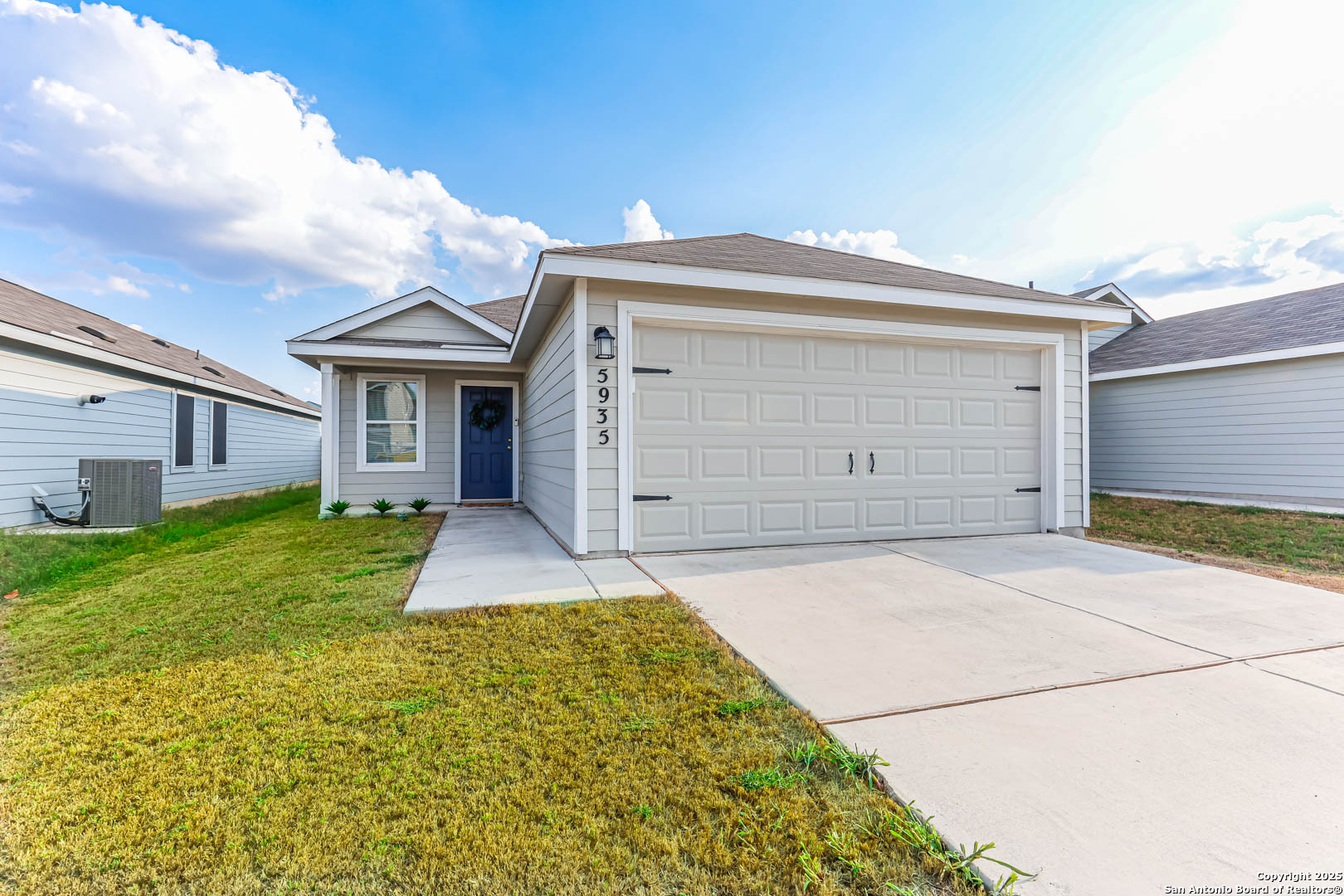 5935 Texas Seguin, TX 78155 - Photo 1 of 20 a front view of a house with a yard and garage