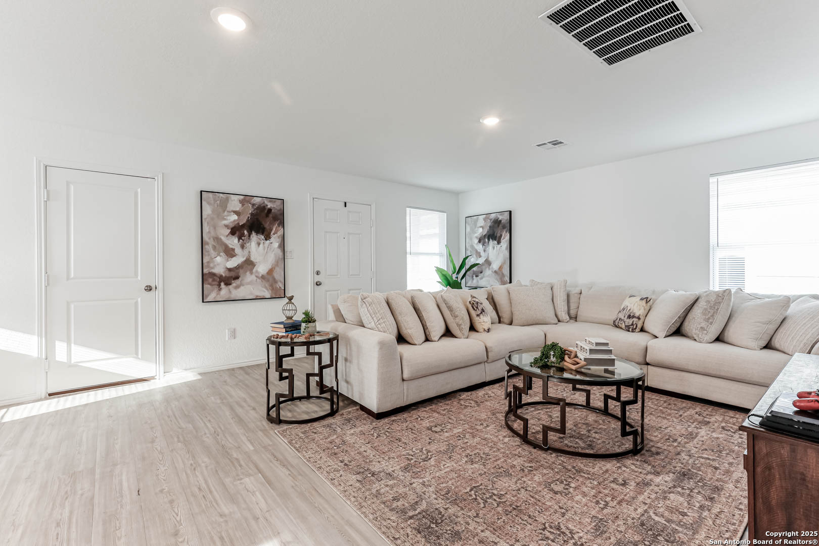 5935 Texas Seguin, TX 78155 - Photo 4 of 20 a living room with furniture a wooden floor and next to a window