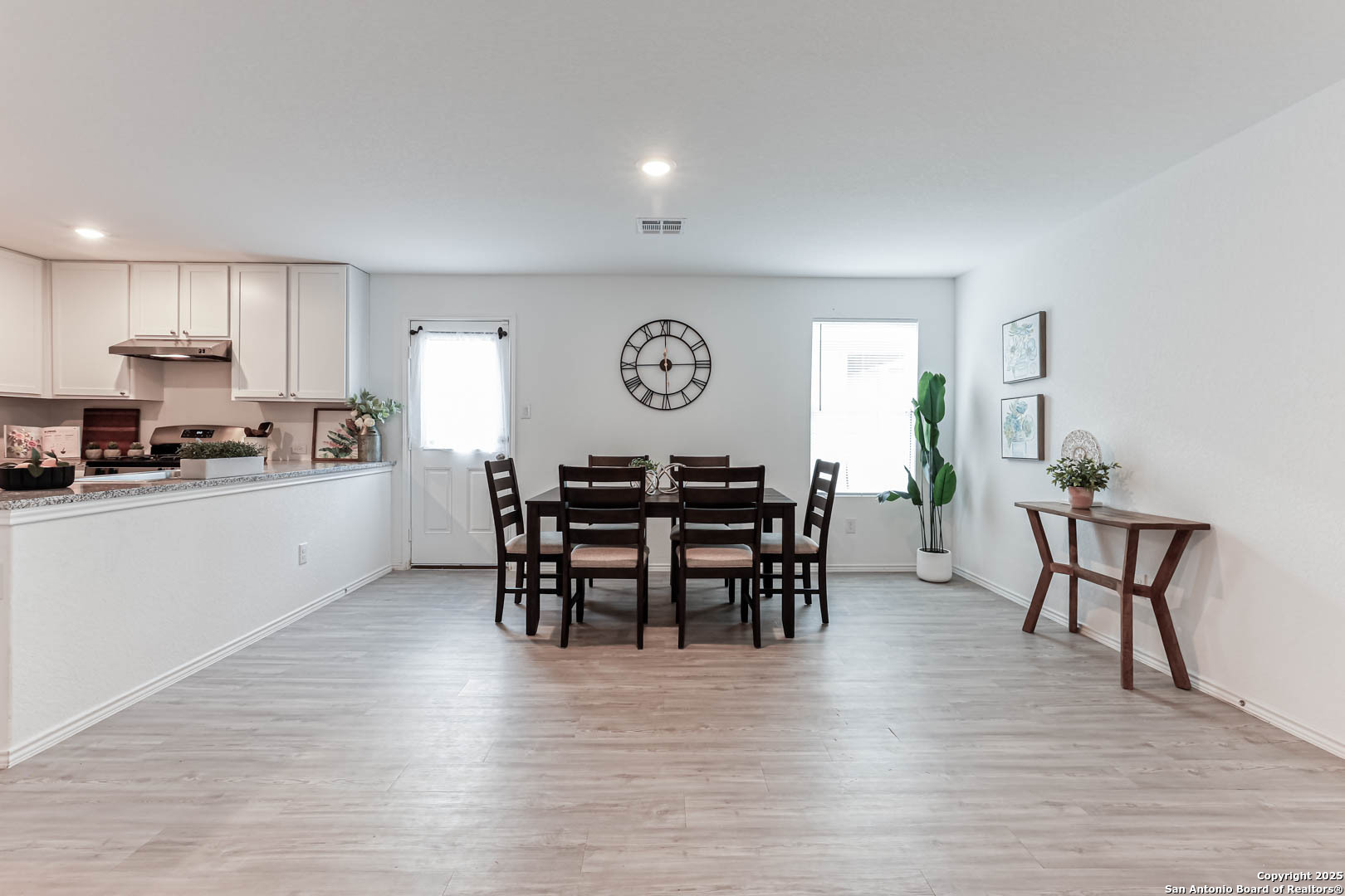 5935 Texas Seguin, TX 78155 - Photo 7 of 20 a view of a dining room with furniture and wooden floor