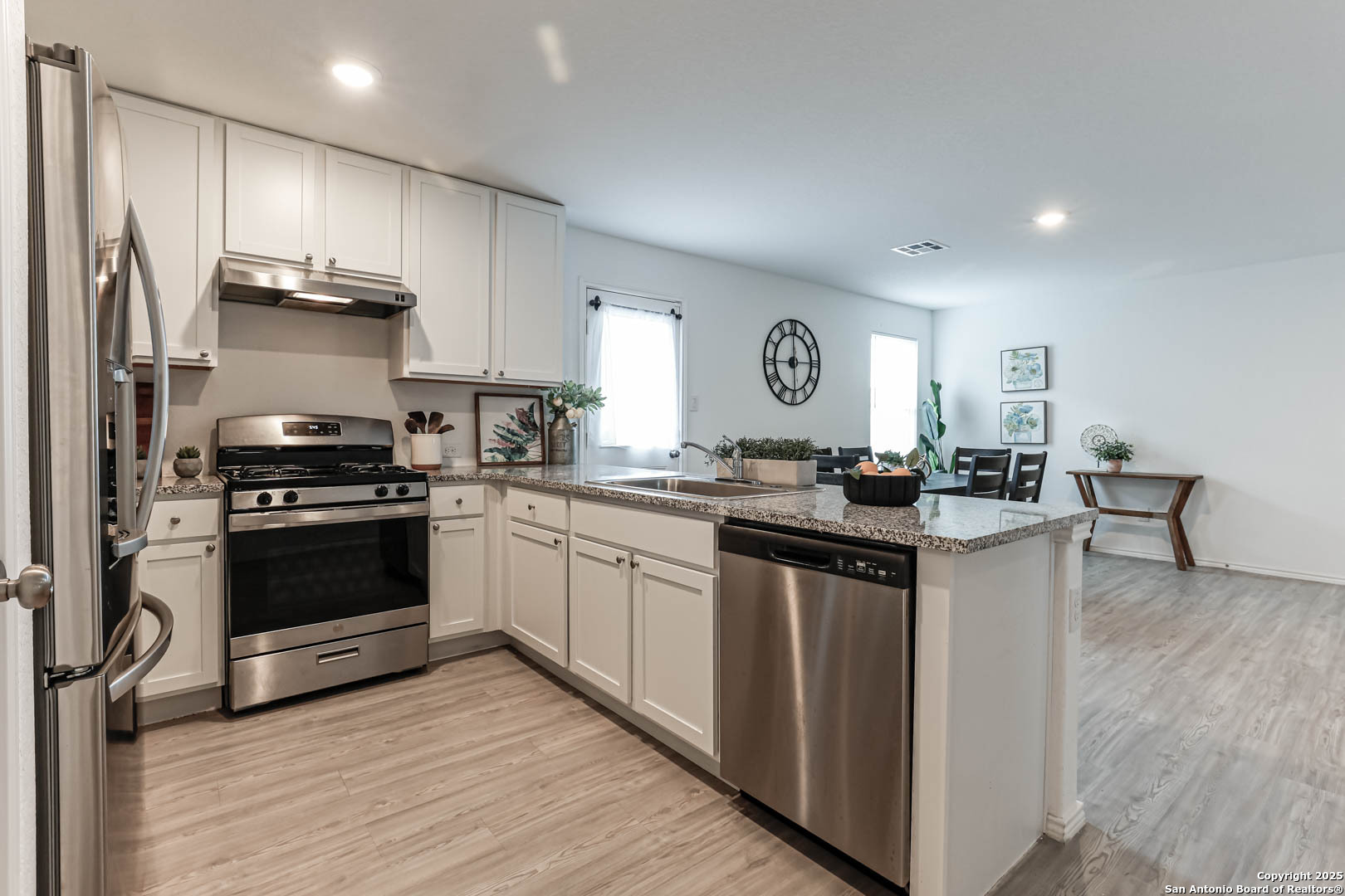 5935 Texas Seguin, TX 78155 - Photo 8 of 20 a kitchen with a sink cabinets and stainless steel appliances