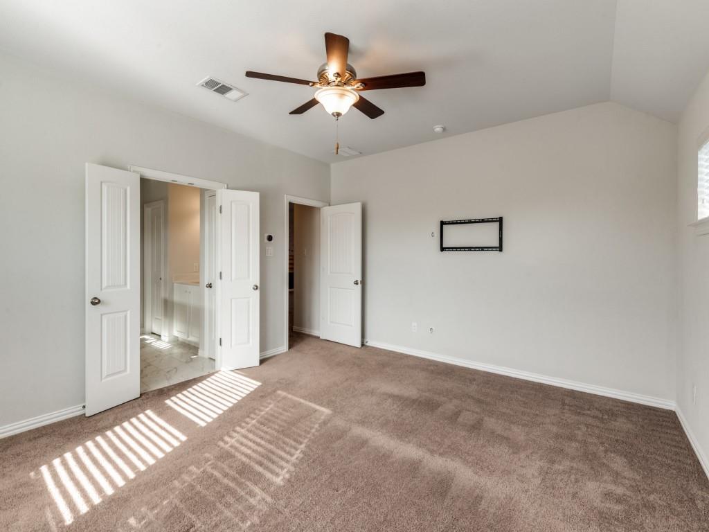 2152 Bailey Street Carrollton, TX 75010 - Photo 16 of 27 a view of a livingroom with a ceiling fan and entryway