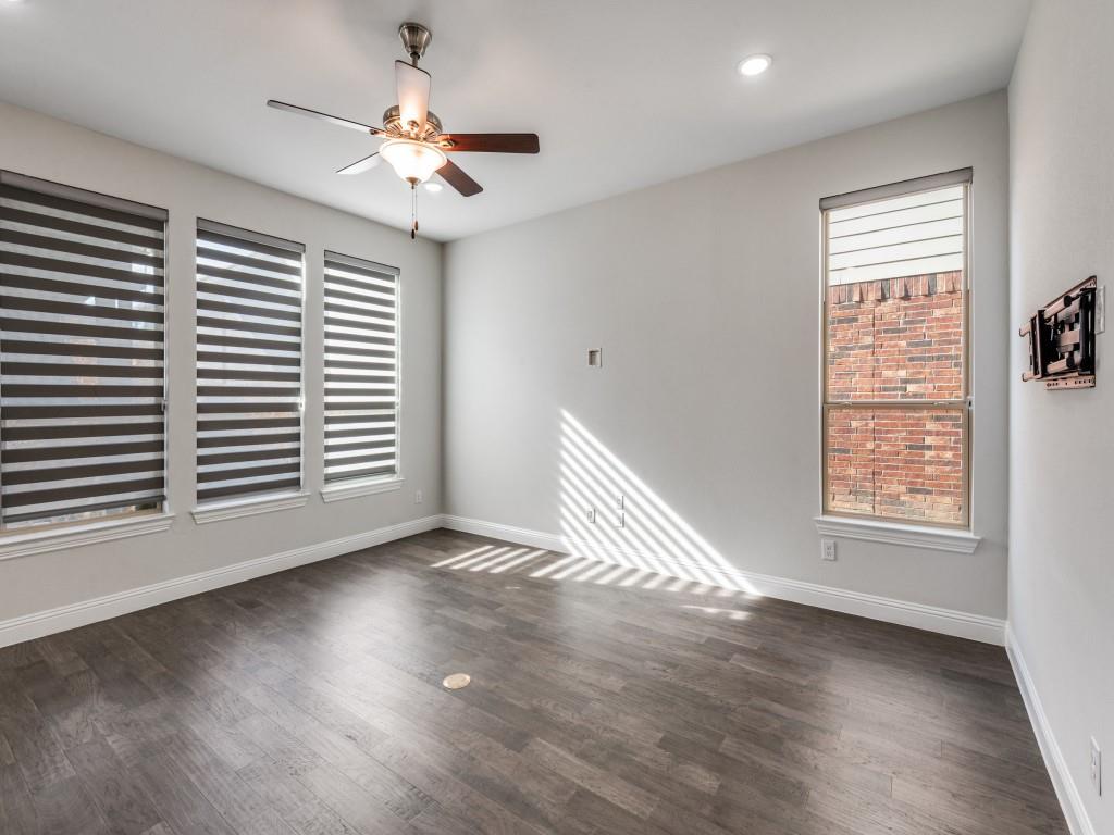 2152 Bailey Street Carrollton, TX 75010 - Photo 8 of 27 an empty room with wooden floor and windows