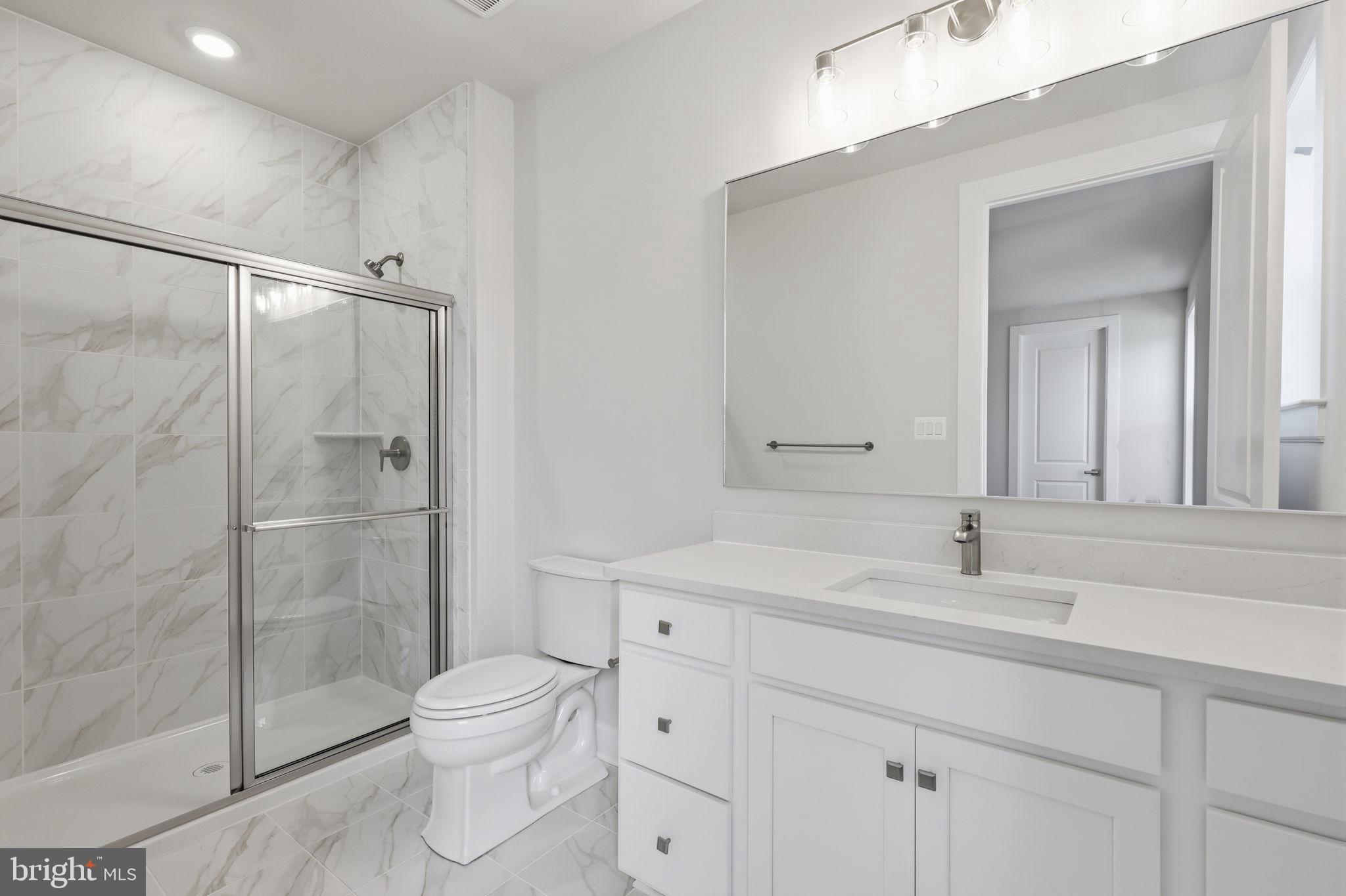 233 Coffman Drive Exton, PA 19341 - Photo 11 of 55 a bathroom with a sink a toilet and shower