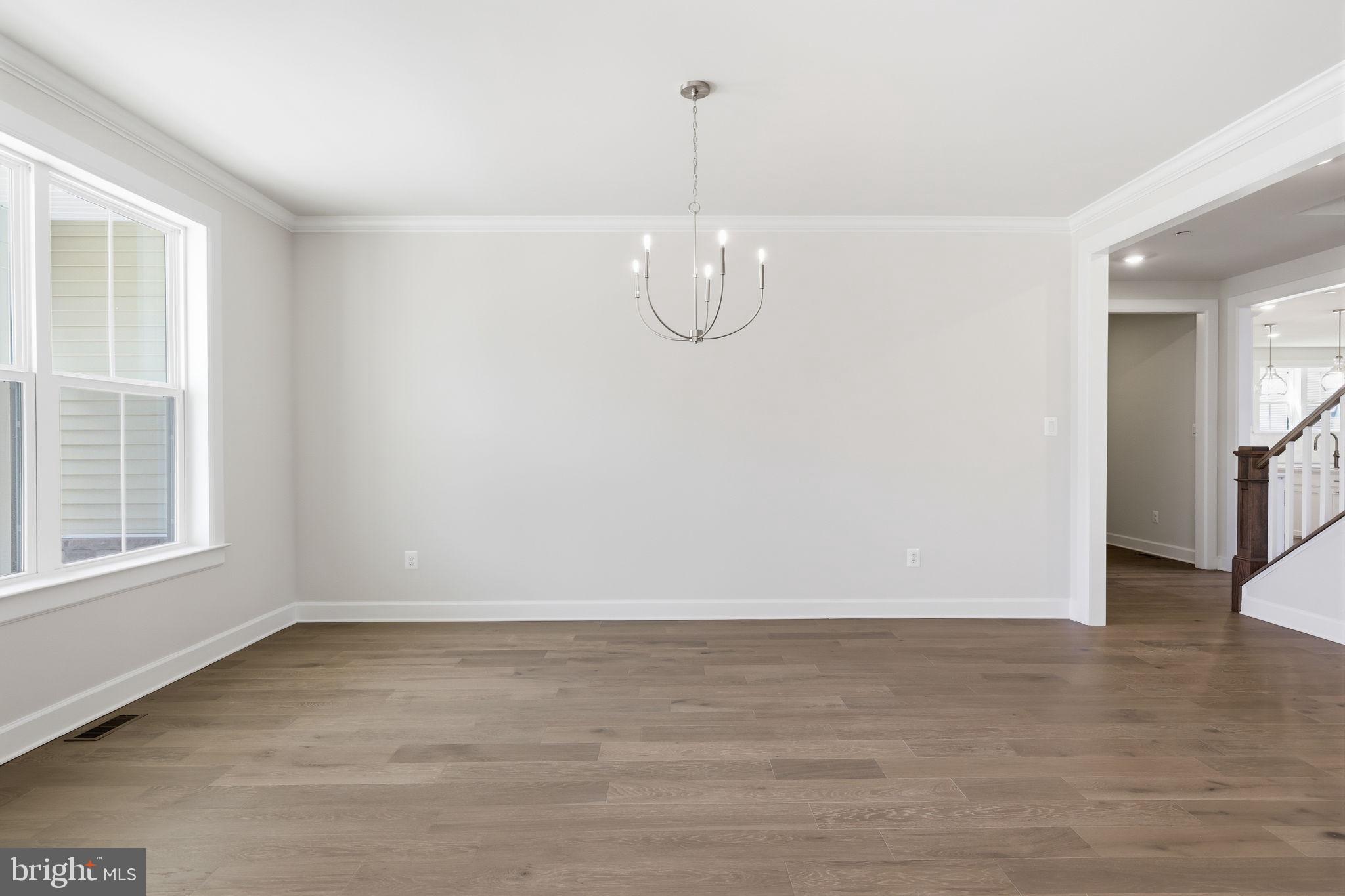 233 Coffman Drive Exton, PA 19341 - Photo 18 of 55 an empty room with wooden floor and windows