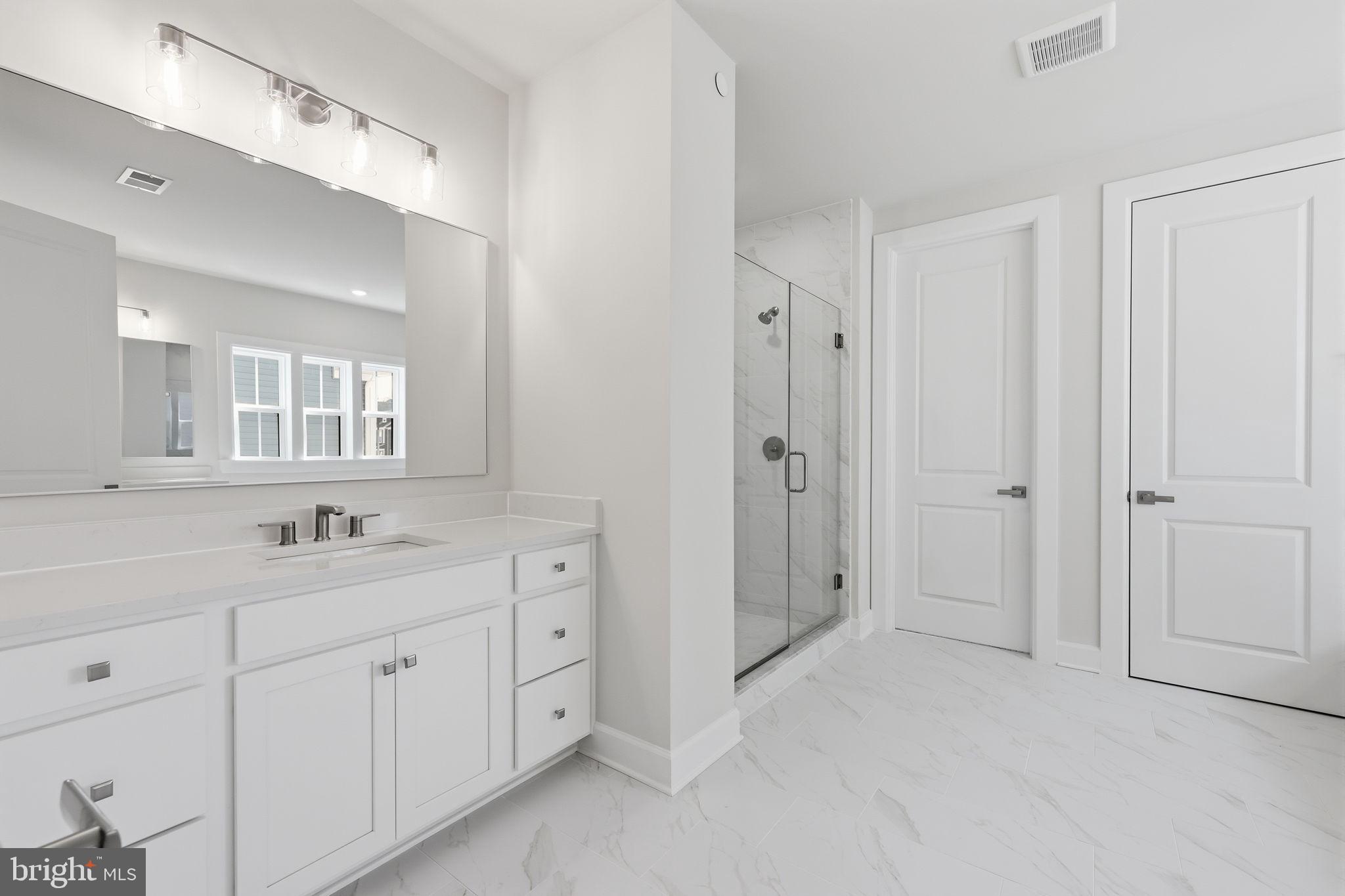 233 Coffman Drive Exton, PA 19341 - Photo 31 of 55 a bathroom with a double vanity sink mirror and