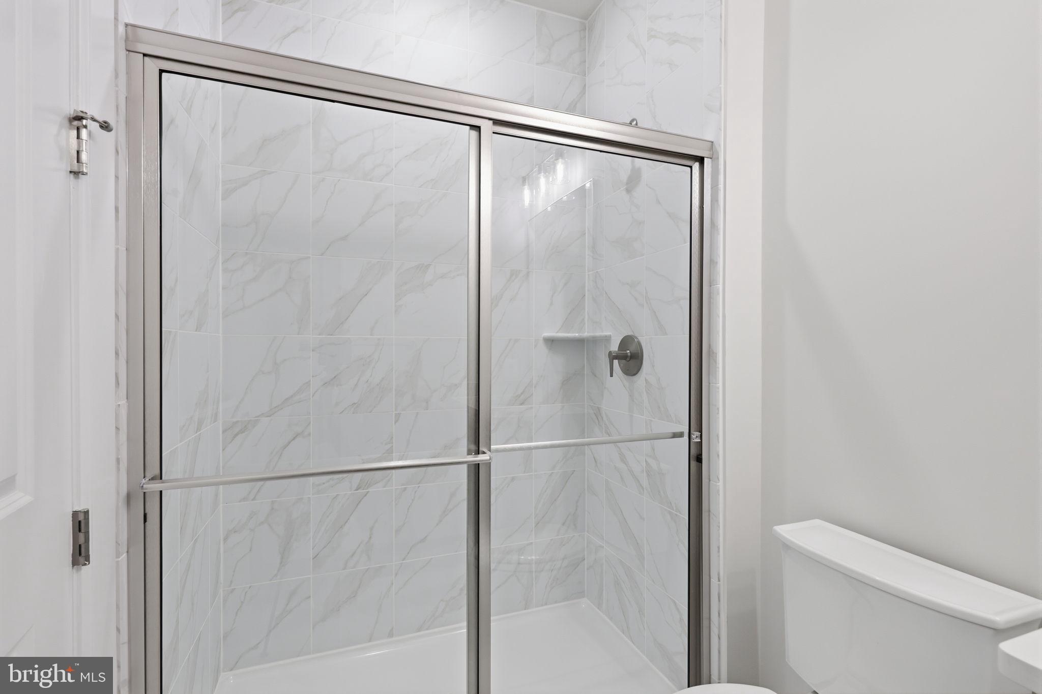 233 Coffman Drive Exton, PA 19341 - Photo 37 of 55 a bathroom with a shower and a toilet