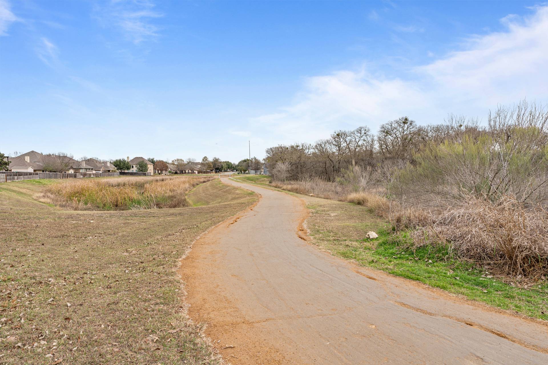 180 Fletcher Bend Buda, TX 78610 - Photo 35 of 36 a view of a lake with a city