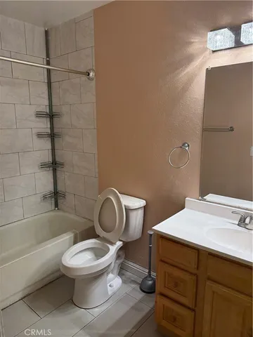 a bathroom with a toilet a sink and bathtub