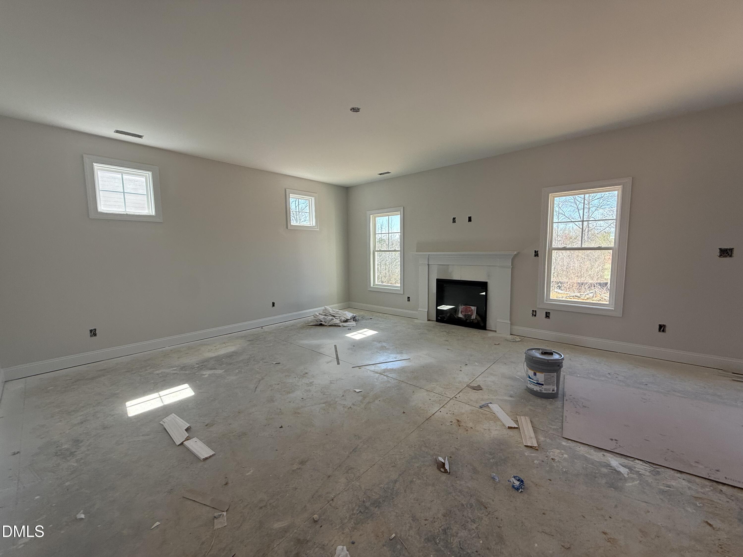 178 Brickendon Raeford, NC 28376 - Photo 2 of 15 an empty room with fireplace and window
