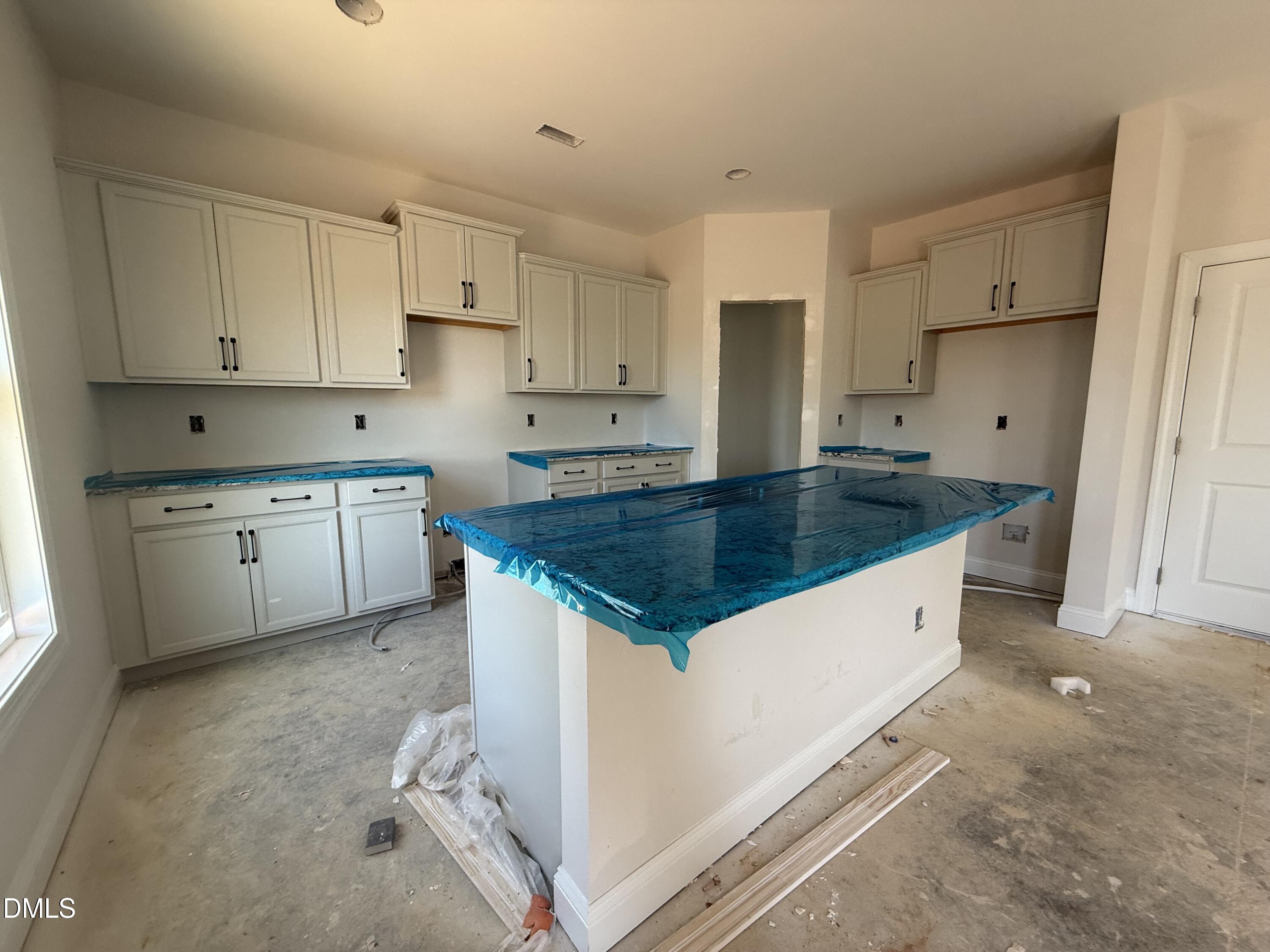 178 Brickendon Raeford, NC 28376 - Photo 4 of 15 a kitchen with granite countertop a sink a stove a refrigerator and white cabinets