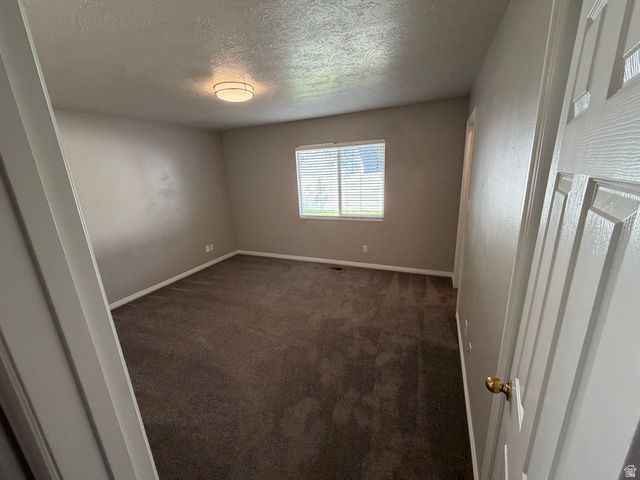 1563 South 600 East Springville, UT 84663 - Photo 14 of 30 Neutral tone wall finishes, white trim, and a window with horizontal blinds provide natural light