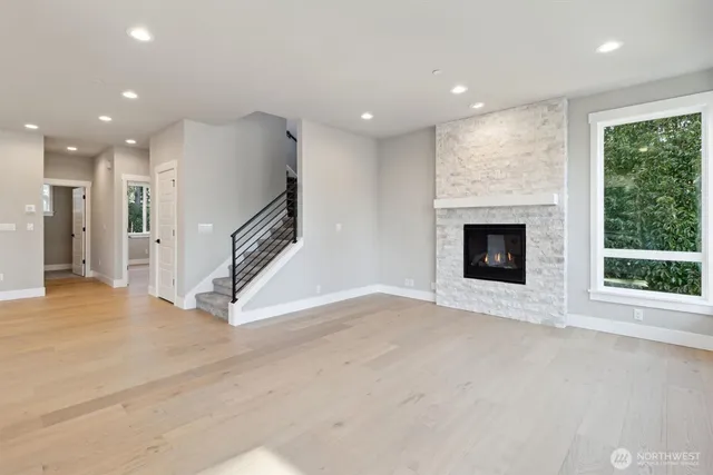 a view of an empty room with a fireplace