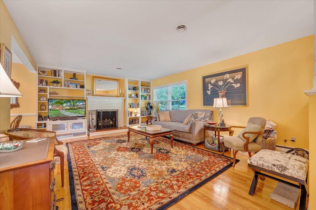 2736 Beverly Boulevard Southwest Roanoke, VA 24015 - Photo 16 of 41 a living room with furniture large window and a fireplace