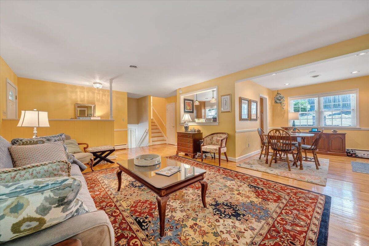 2736 Beverly Boulevard Southwest Roanoke, VA 24015 - Photo 18 of 41 a living room with furniture a dining table and chairs with wooden floor