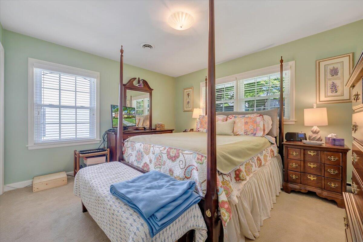 2736 Beverly Boulevard Southwest Roanoke, VA 24015 - Photo 29 of 41 a bedroom with a bed and wooden floor