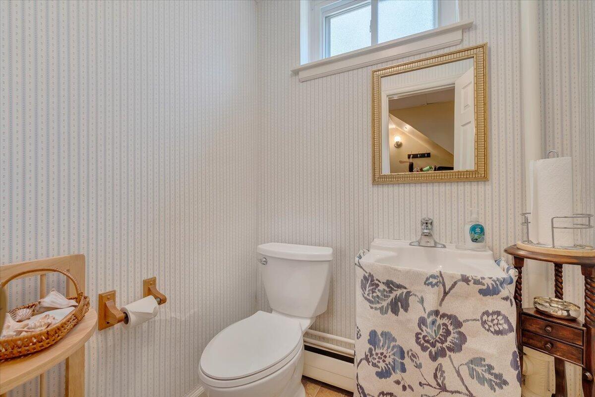 2736 Beverly Boulevard Southwest Roanoke, VA 24015 - Photo 38 of 41 a bathroom with a toilet sink and mirror