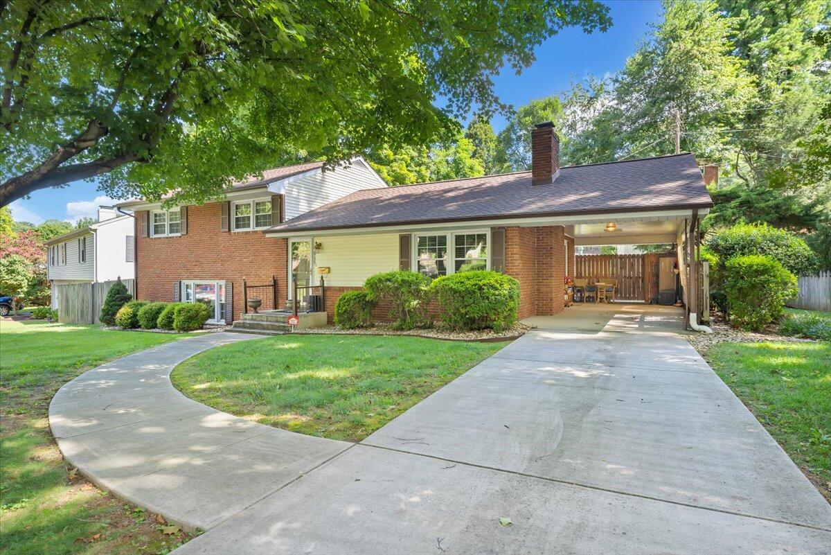 2736 Beverly Boulevard Southwest Roanoke, VA 24015 - Photo 5 of 41 a front view of a house with a yard