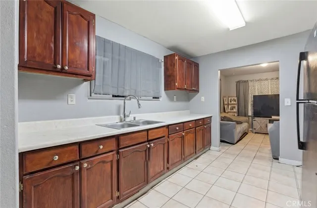 a utility room with cabinets washer and dryer