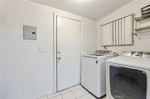 a living room with furniture a dining table and wooden floor
