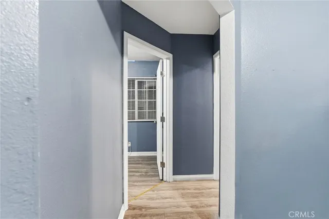 a kitchen with cabinets and stainless steel appliances