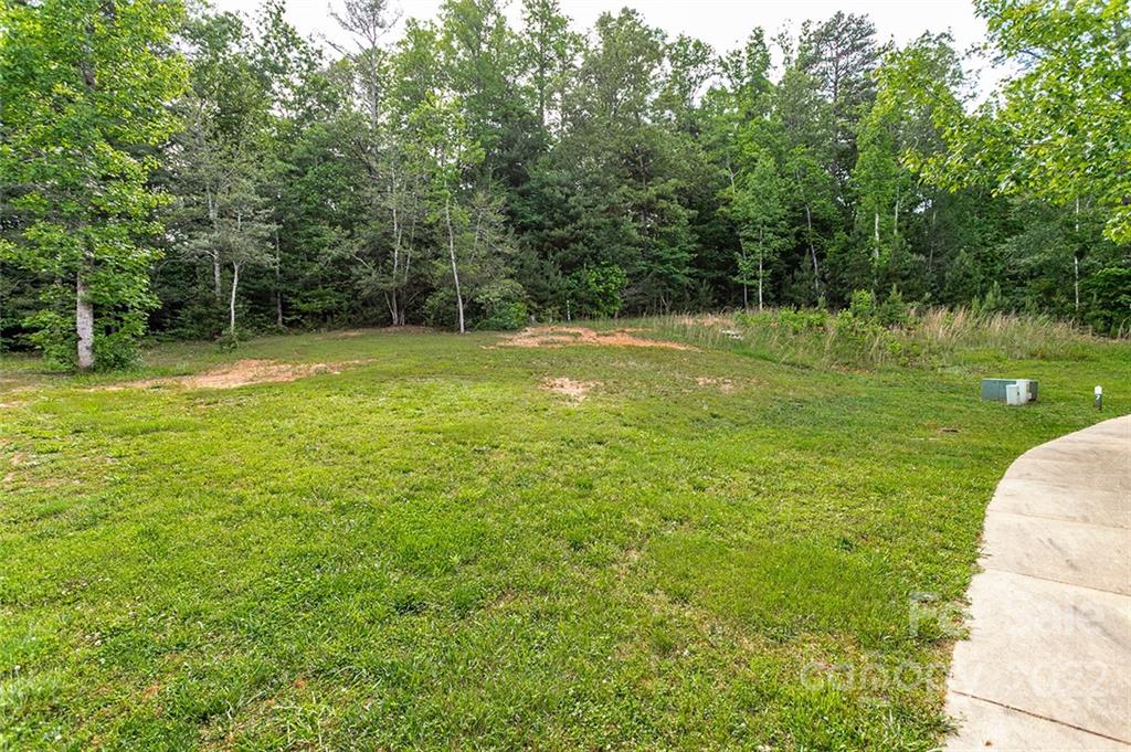 Tbd Cadence Circle, Unit THREE DEVELOPER LOTS Brevard, NC 28712 - Photo 13 of 16 a view of a garden with a wooden fence