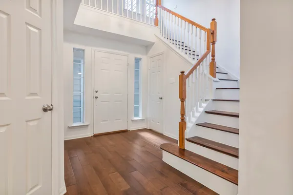 a view of entryway with wooden floor