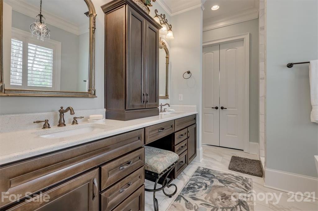 2886 Holbrook Road Fort Mill, SC 29715 - Photo 14 of 34 a spacious bathroom with a granite countertop sink and a mirror