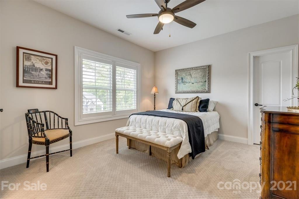 2886 Holbrook Road Fort Mill, SC 29715 - Photo 23 of 34 a spacious bedroom with a bed and chair