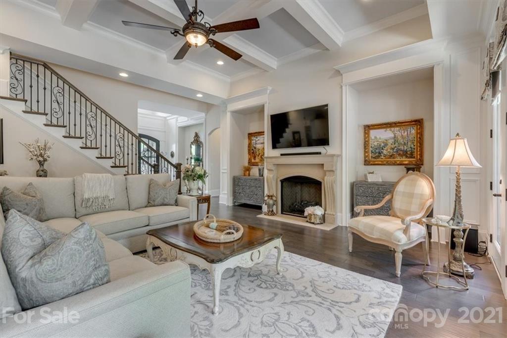 2886 Holbrook Road Fort Mill, SC 29715 - Photo 4 of 34 a living room with furniture a fireplace and a flat screen tv