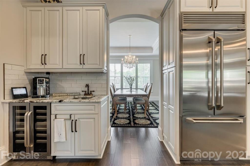2886 Holbrook Road Fort Mill, SC 29715 - Photo 10 of 34 a kitchen with stainless steel appliances granite countertop a stove a refrigerator and a cabinets