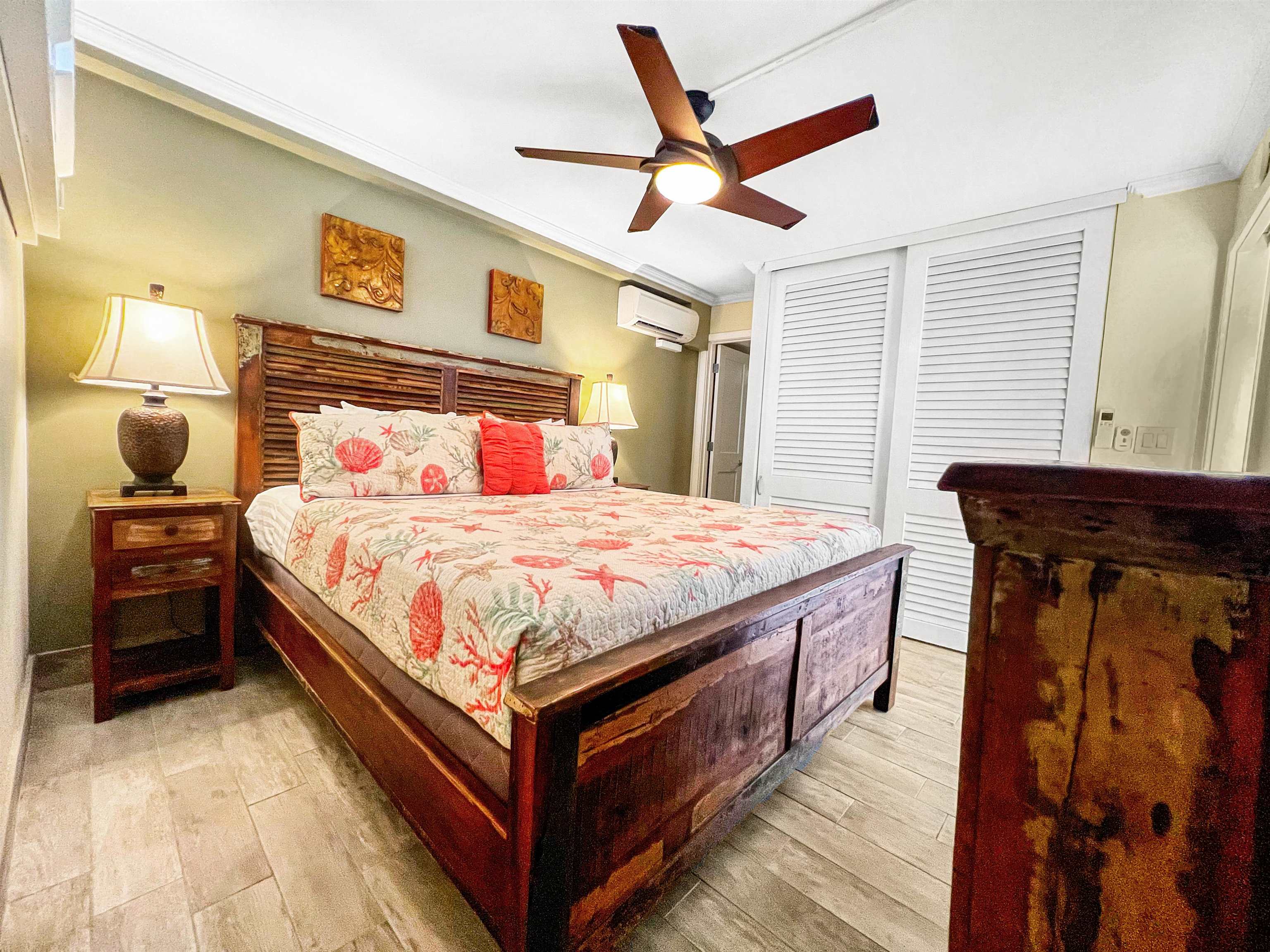 2936 South Kihei Road, Unit 512 Kihei, HI 96753 - Photo 11 of 20 a bedroom with a bed and a walk in closet