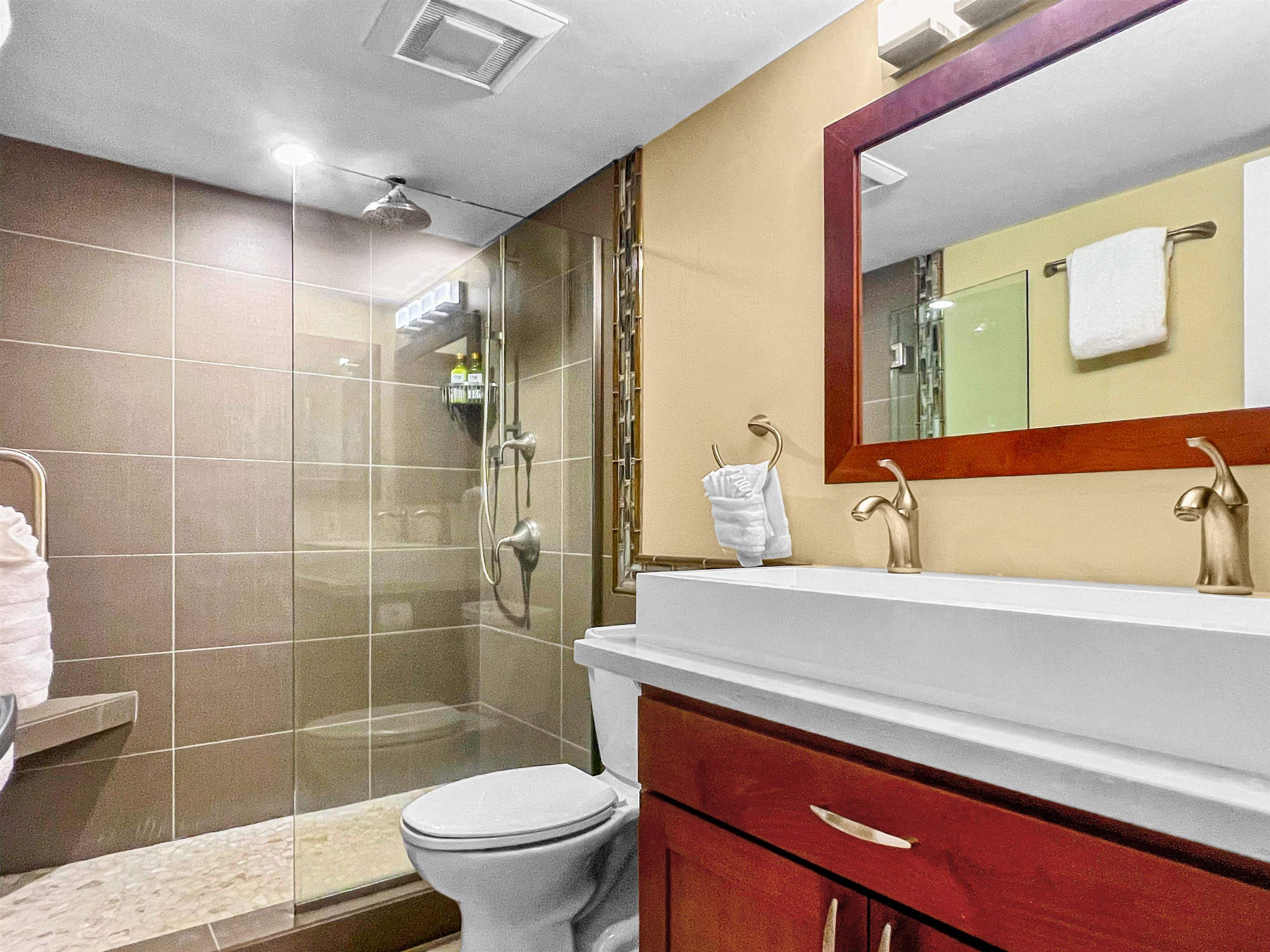 2936 South Kihei Road, Unit 512 Kihei, HI 96753 - Photo 12 of 20 a bathroom with a sink a toilet and shower