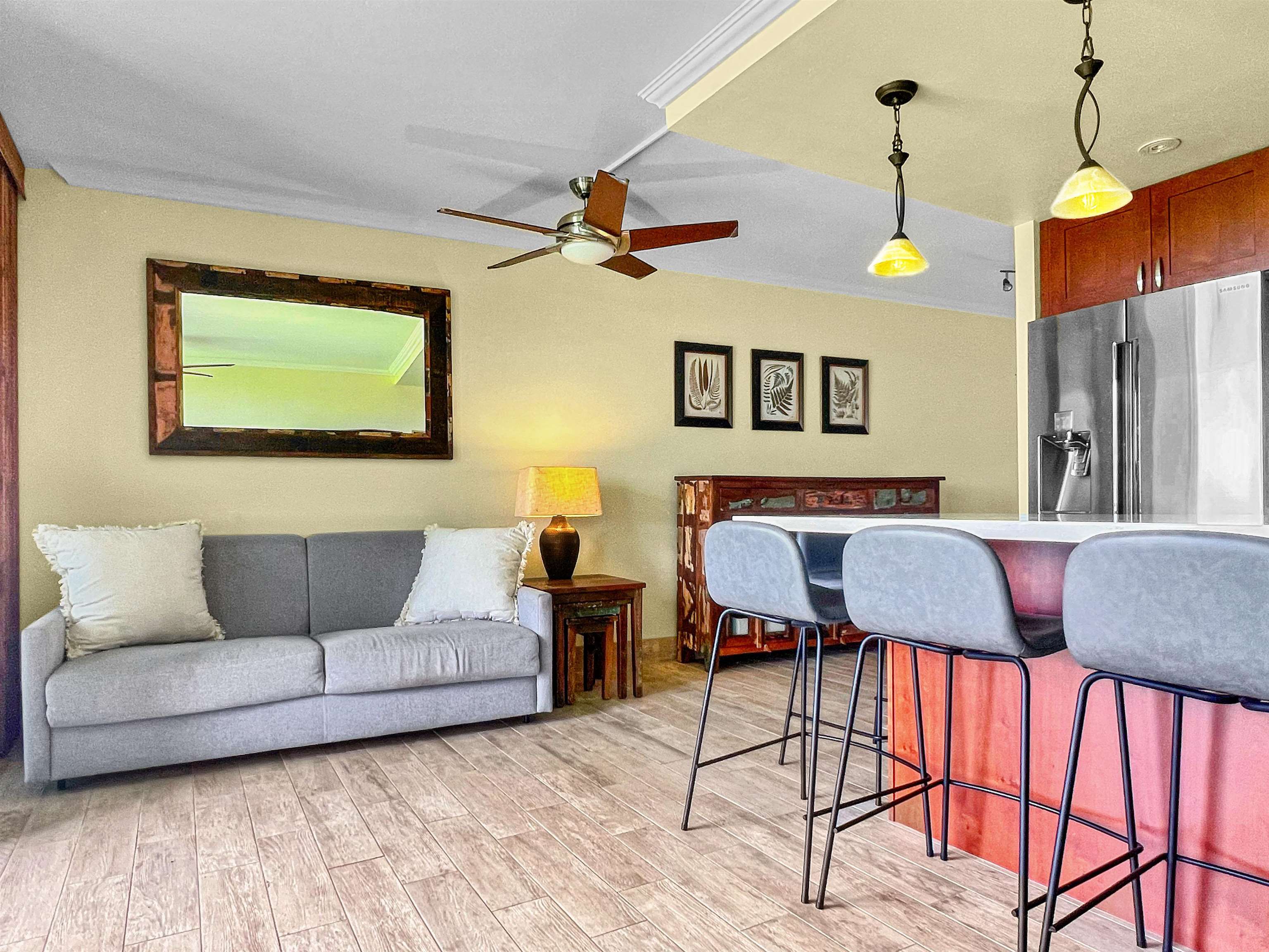 2936 South Kihei Road, Unit 512 Kihei, HI 96753 - Photo 7 of 20 a living room with furniture and a flat screen tv