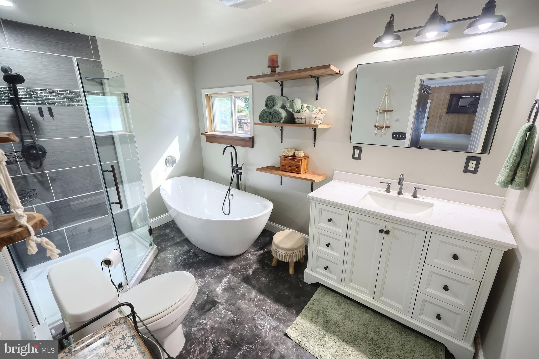 1111 Richmond Road Red Lion, PA 17356 - Photo 19 of 57 a spacious bathroom with a toilet sink and mirror