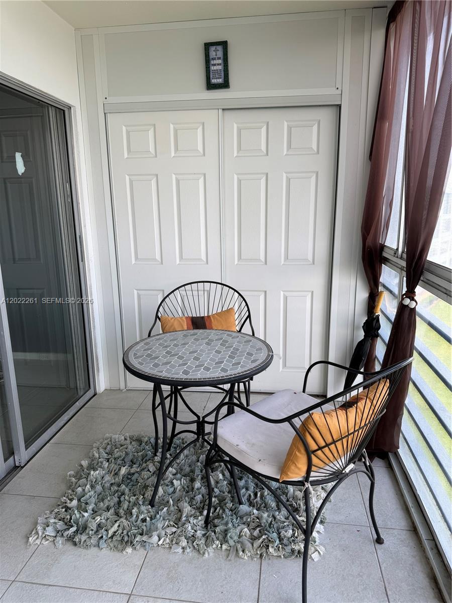 4043 Cornwall C, Unit 4043 Boca Raton, FL 33434 - Photo 7 of 16 a view of a hallway with chairs