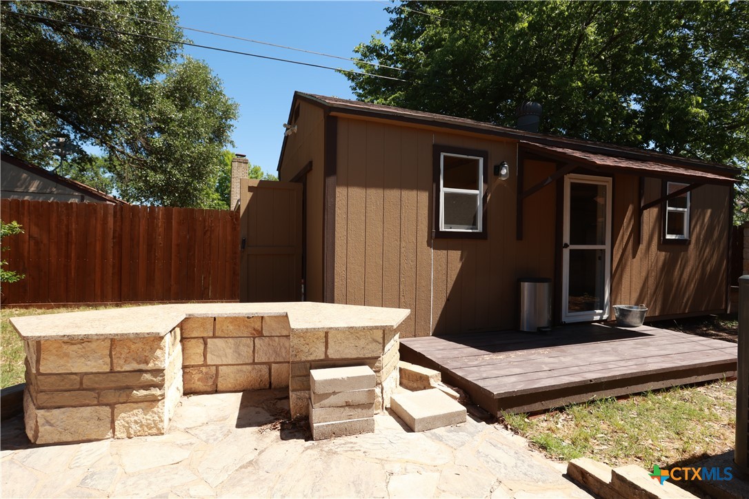 2706 Bowie Trail Temple, TX 76502 - Photo 22 of 25 a backyard of a house with barbeque oven and outdoor seating