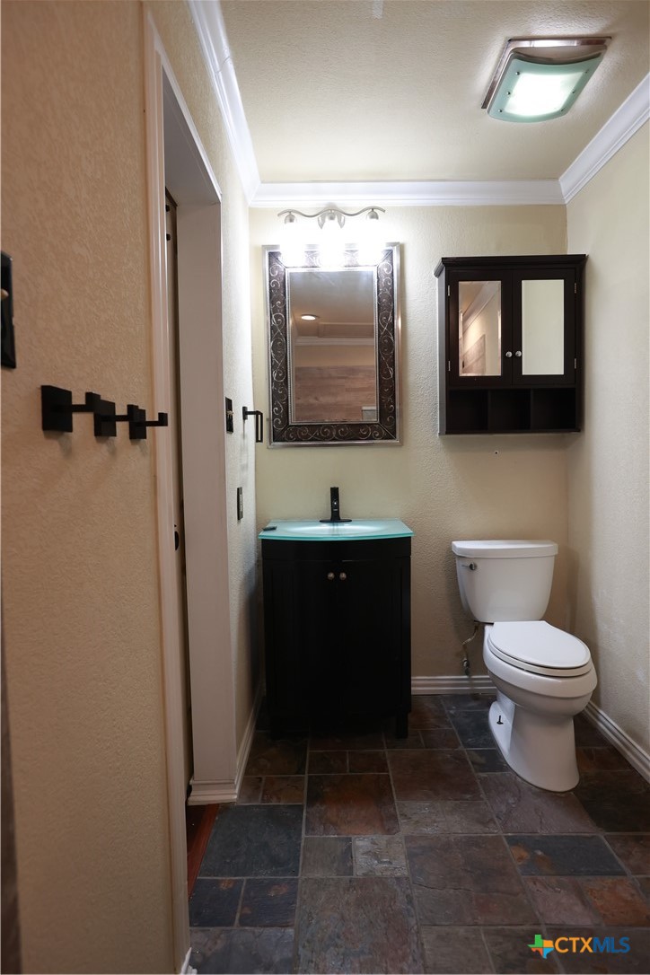 2706 Bowie Trail Temple, TX 76502 - Photo 5 of 25 a bathroom with a toilet sink and mirror