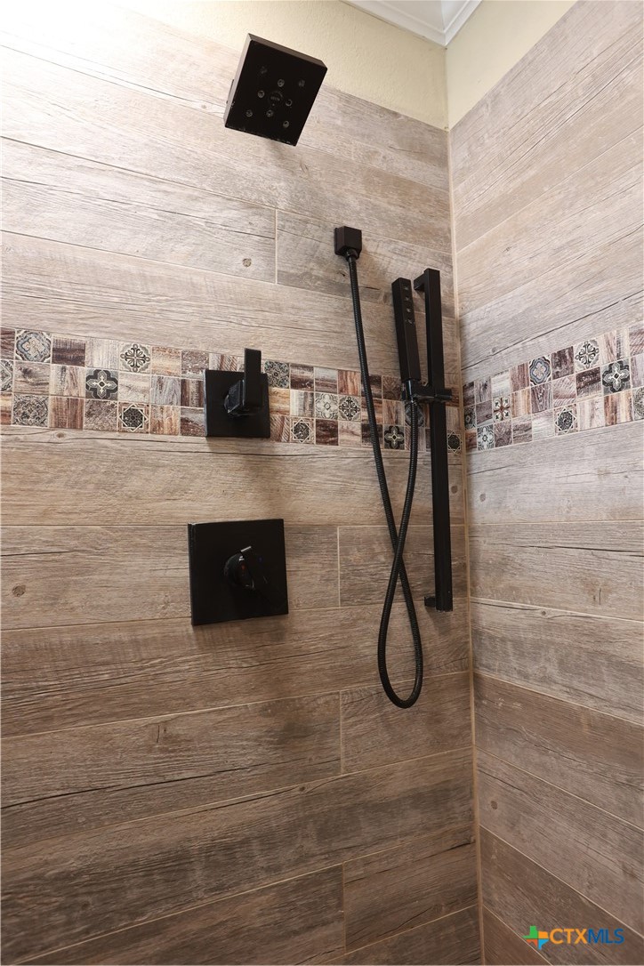 2706 Bowie Trail Temple, TX 76502 - Photo 7 of 25 a room with wooden floor and brick wall