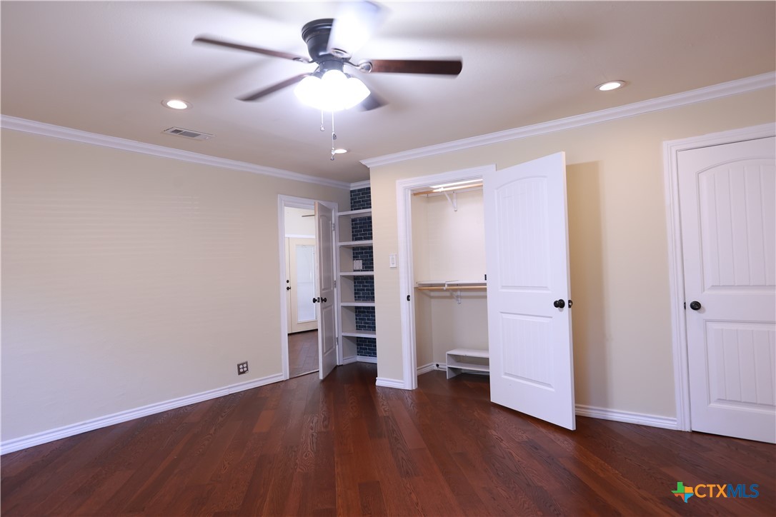 2706 Bowie Trail Temple, TX 76502 - Photo 9 of 25 a view of an empty room with a window and wooden floor