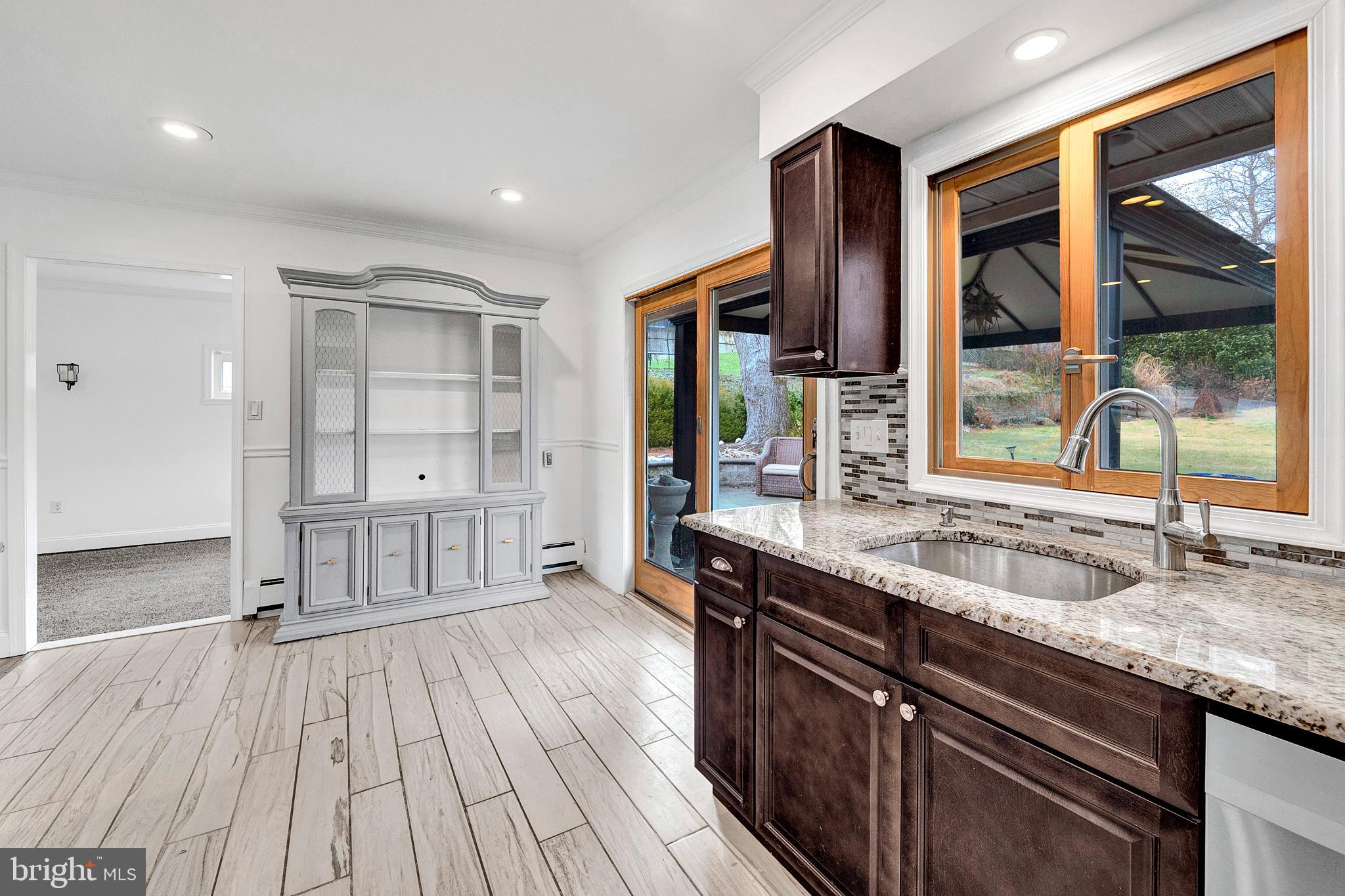 6 Unity Turn Levittown, PA 19056 - Photo 18 of 50 a kitchen with a sink and wooden floor
