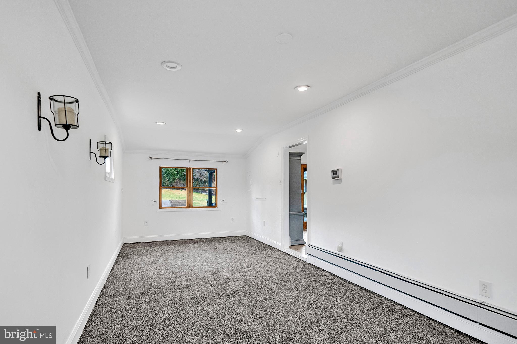 6 Unity Turn Levittown, PA 19056 - Photo 21 of 50 an empty room with windows and painted walls