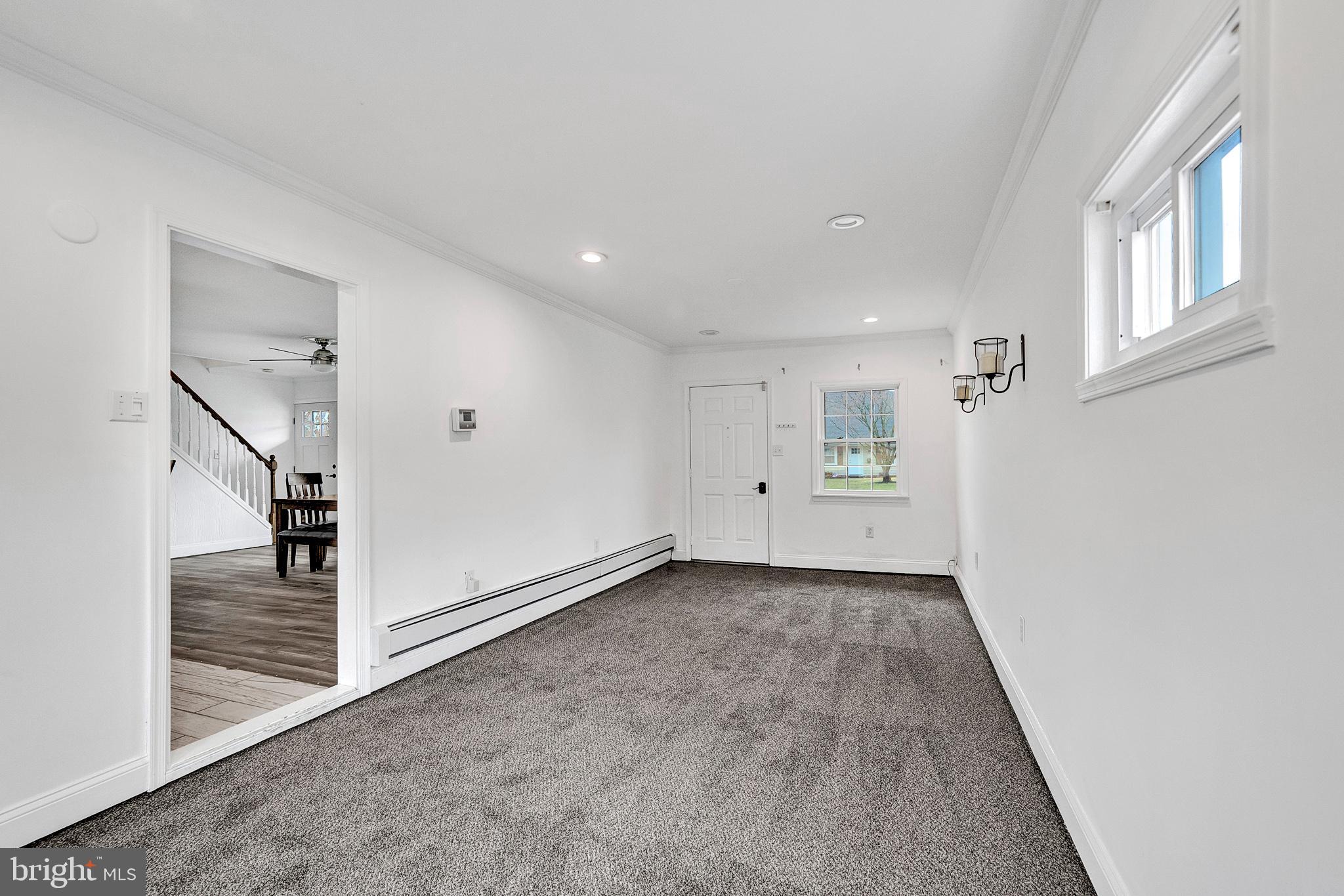 6 Unity Turn Levittown, PA 19056 - Photo 23 of 50 wooden floor in an empty room with a window