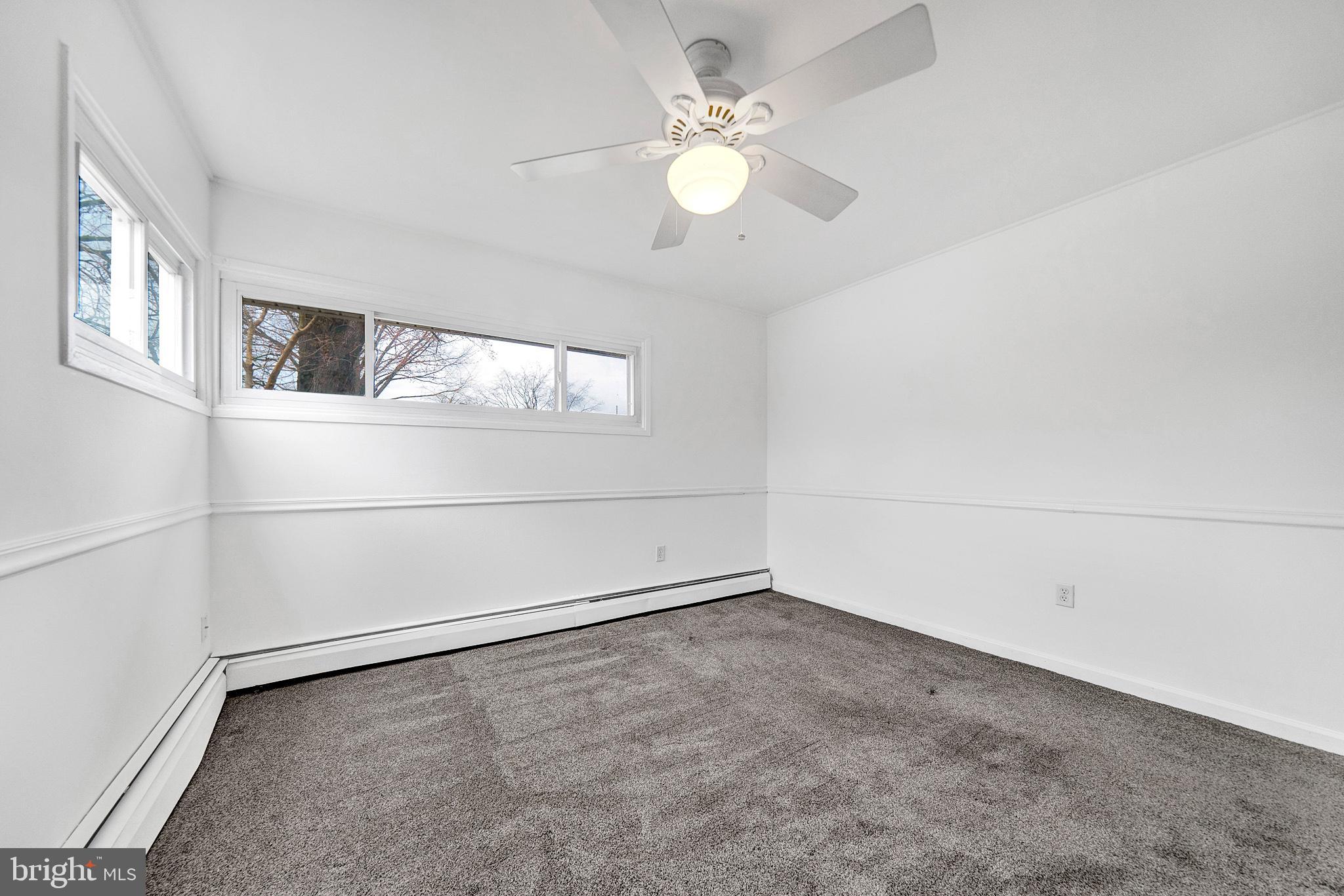6 Unity Turn Levittown, PA 19056 - Photo 26 of 50 wooden floor in an empty room with a window