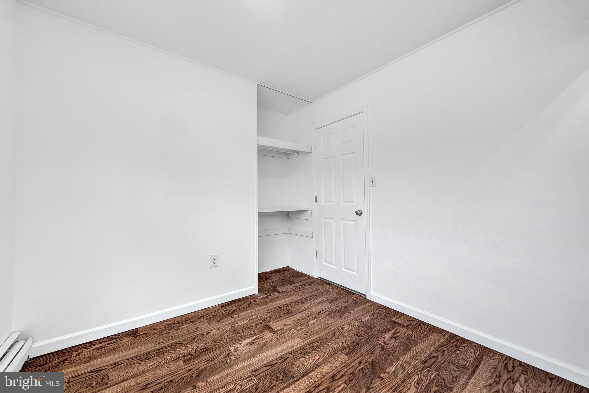 6 Unity Turn Levittown, PA 19056 - Photo 29 of 50 a view of empty room with wooden floor
