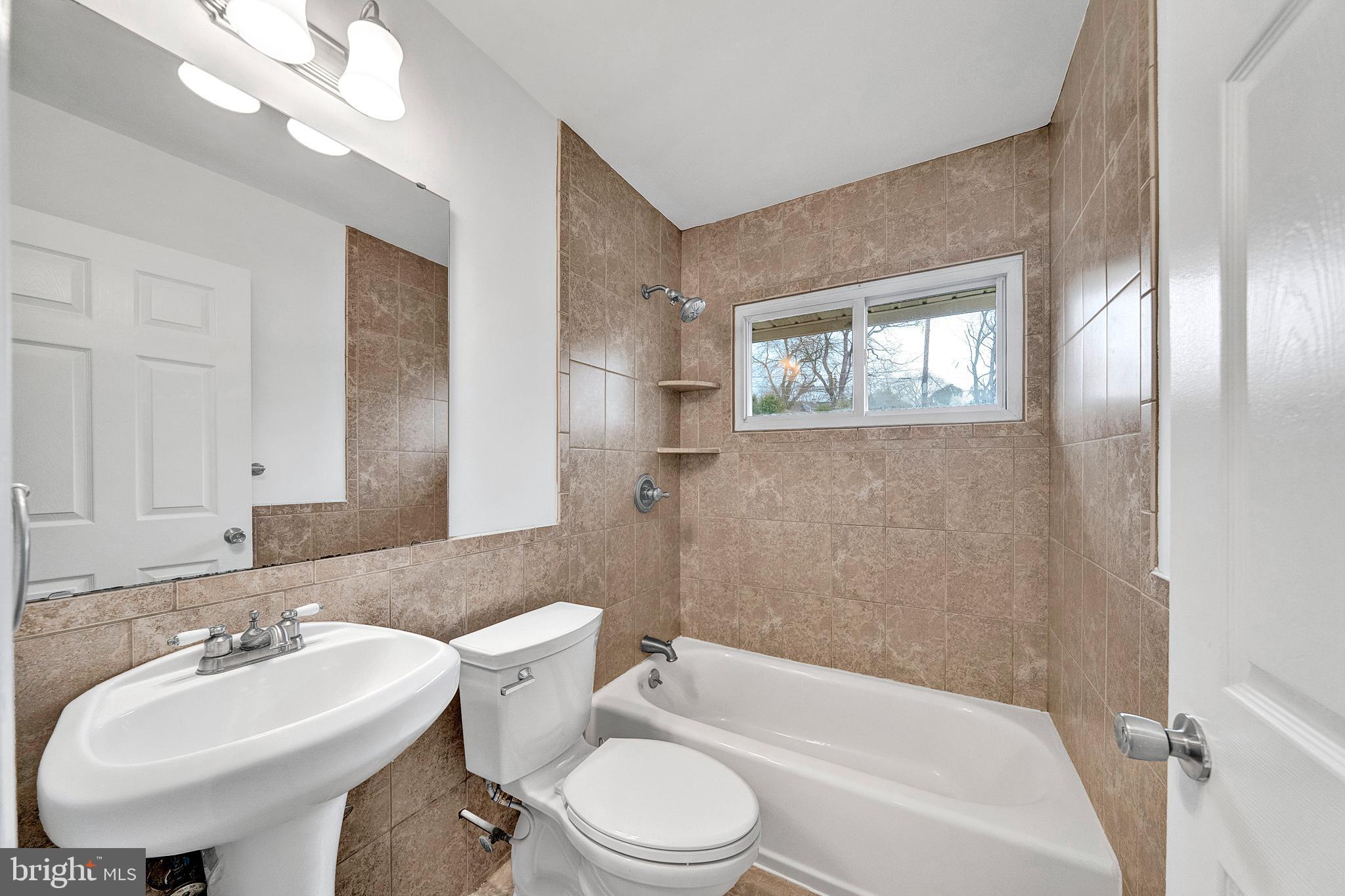 6 Unity Turn Levittown, PA 19056 - Photo 30 of 50 a bathroom with a toilet a sink and bathtub